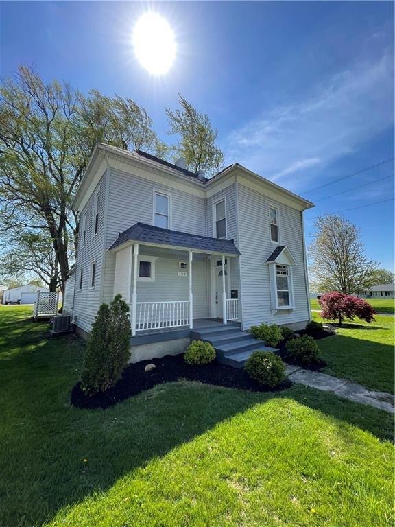 120 South Walnut Street Assumption, IL 62510 - Photo 1 of 1 a front view of a house with garden