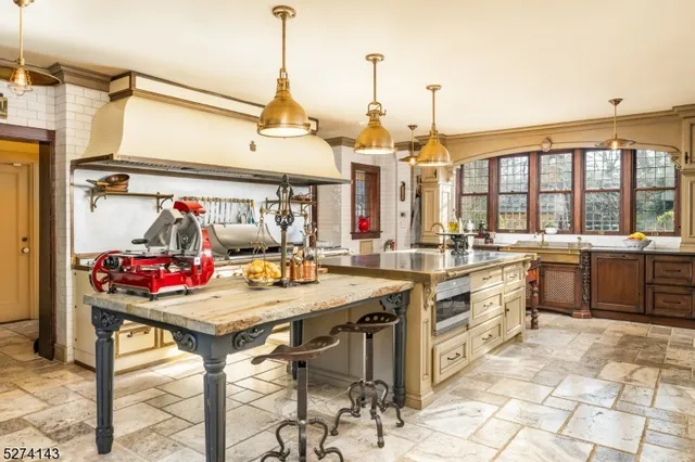 a dining room with a granite top table and chairs