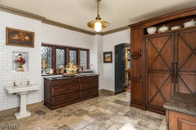 a kitchen with stainless steel appliances a sink and a stove