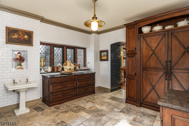 12 Canfield Road Morristown, NJ 07960 - Photo 23 of 49 a room with round mirror and furniture