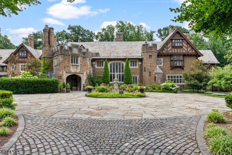 12 Canfield Road Morristown, NJ 07960 - Photo 45 of 49 a front view of a house with a yard and a garage