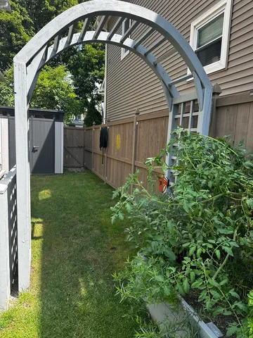 a backyard of a house with lots of green space