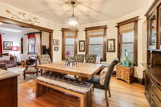 a view of a dining room with furniture window and wooden floor