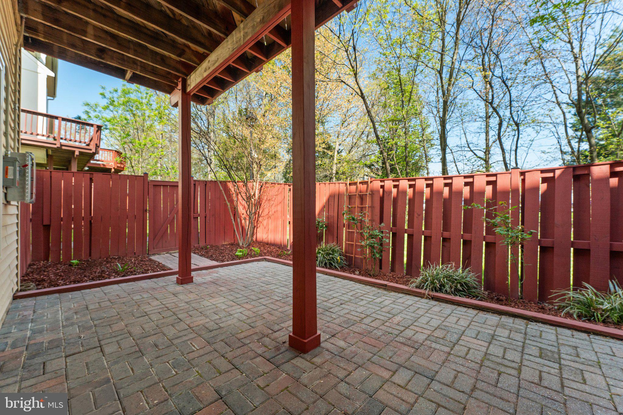 2068 Capstone Circle Herndon, VA 20170 - Photo 22 of 29 Fenced Brick Patio and Gardening Areas