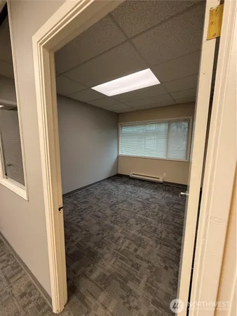a view of a big room with windows