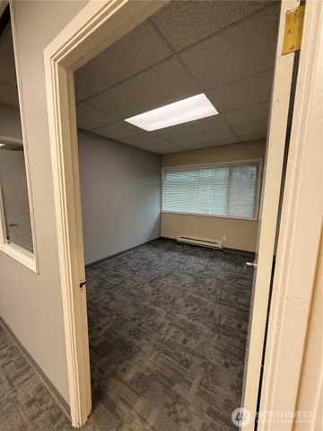 a view of a big room with windows