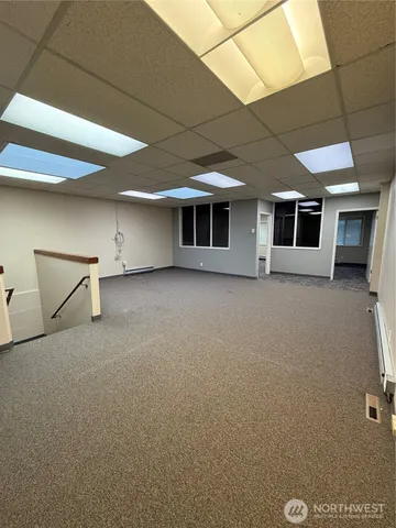 a kitchen with a refrigerator and a stove