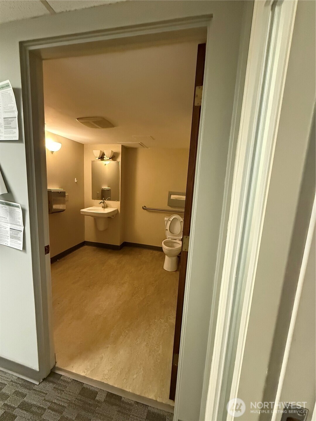 111 West Harrison Street Seattle, WA 98119 - Photo 22 of 25 a bathroom with a granite countertop sink and a mirror