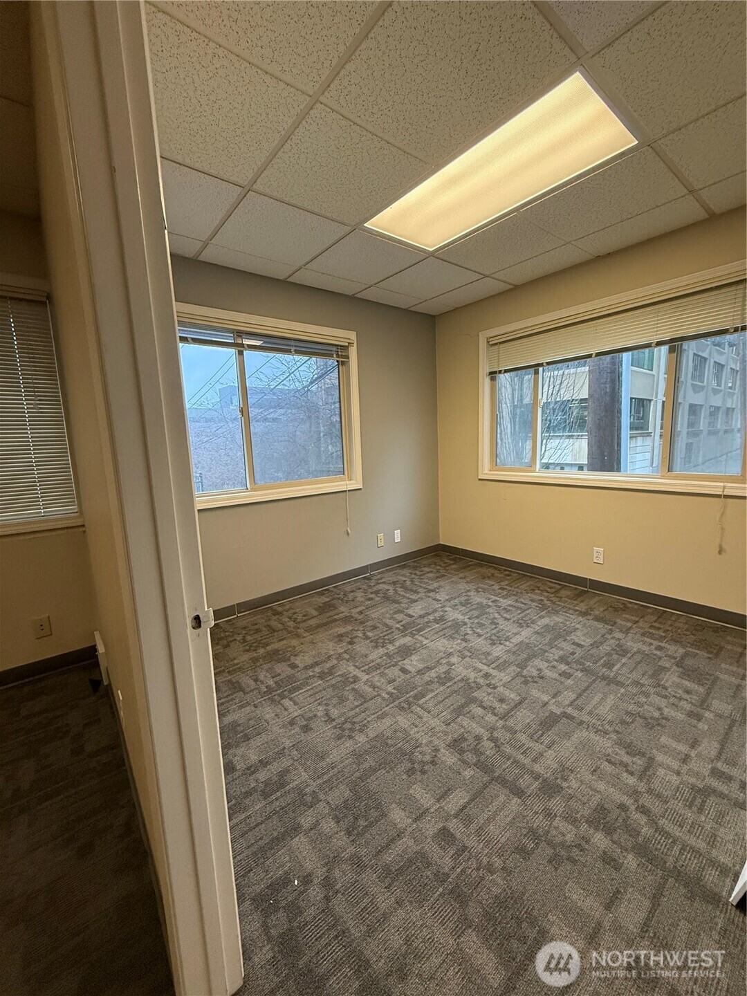 111 West Harrison Street Seattle, WA 98119 - Photo 5 of 25 a view of an empty room with a window