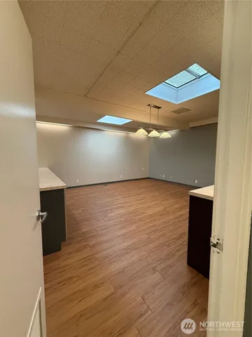 a kitchen with stainless steel appliances a cabinets and a fireplace