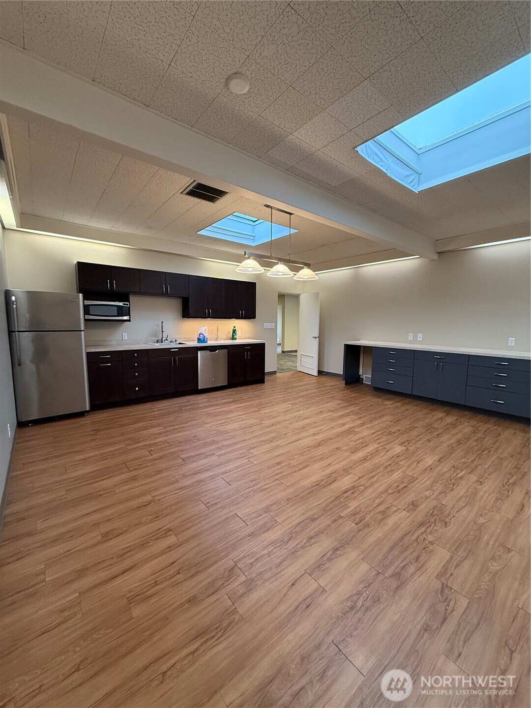 111 West Harrison Street Seattle, WA 98119 - Photo 8 of 25 a large parking space in a room