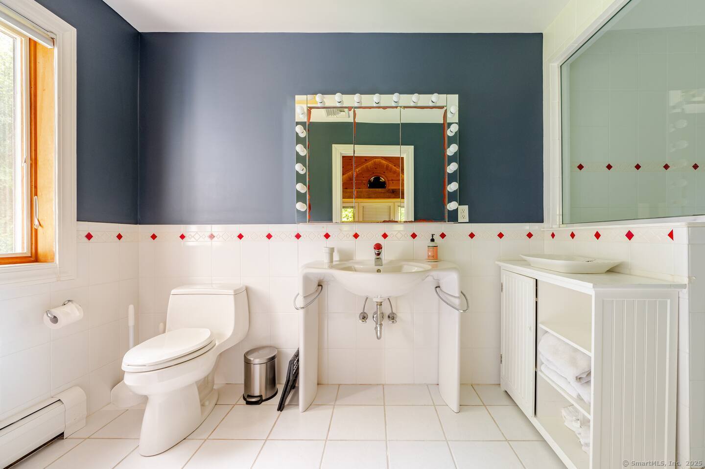 31 Cedar Hill Road New Milford, CT 06755 - Photo 17 of 40 a bathroom with a sink a toilet and a mirror