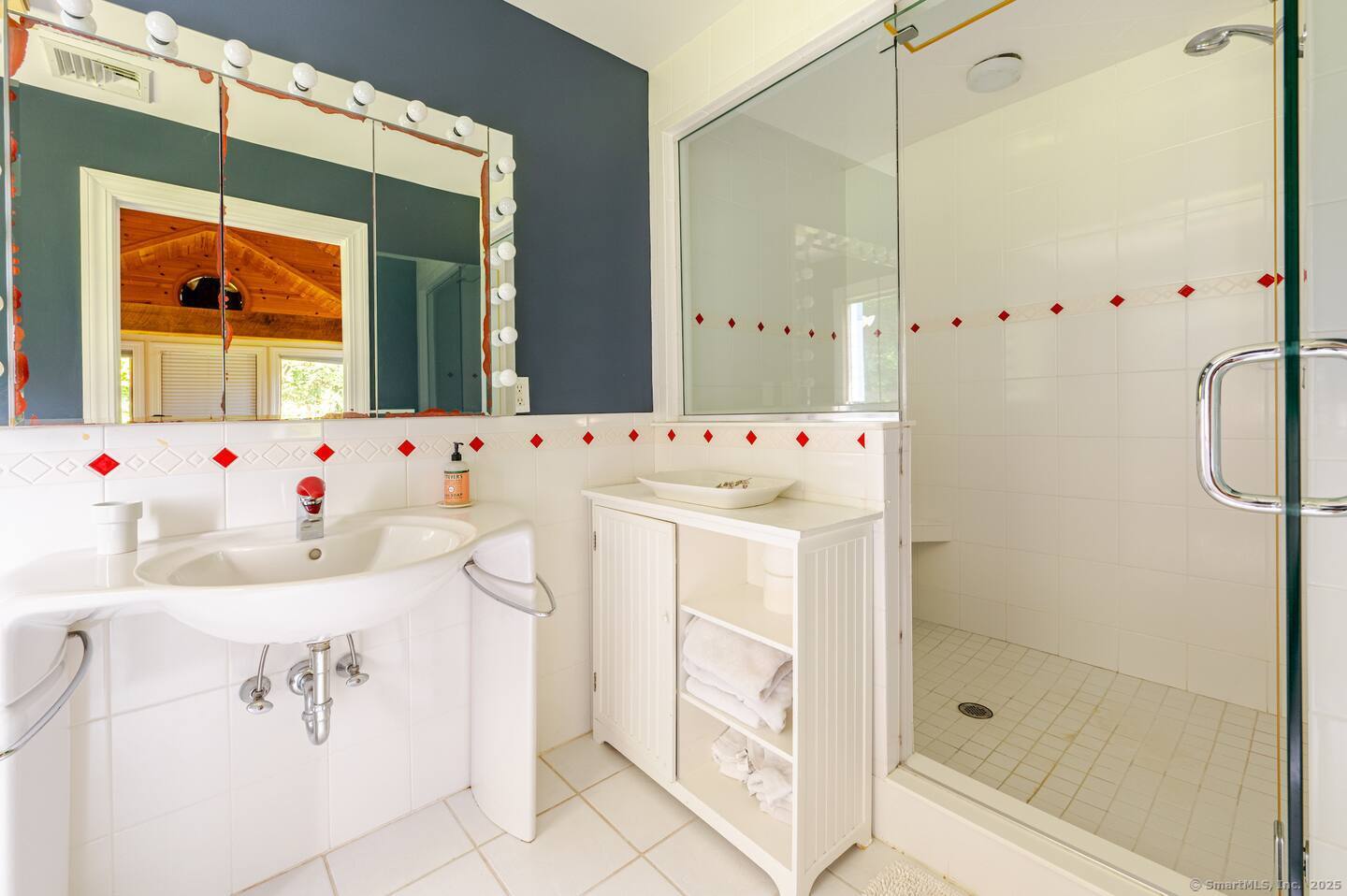 31 Cedar Hill Road New Milford, CT 06755 - Photo 19 of 40 a bathroom with a window and white walls