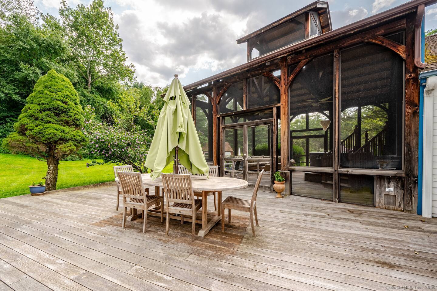 31 Cedar Hill Road New Milford, CT 06755 - Photo 31 of 40 a view of a house with wooden deck and furniture