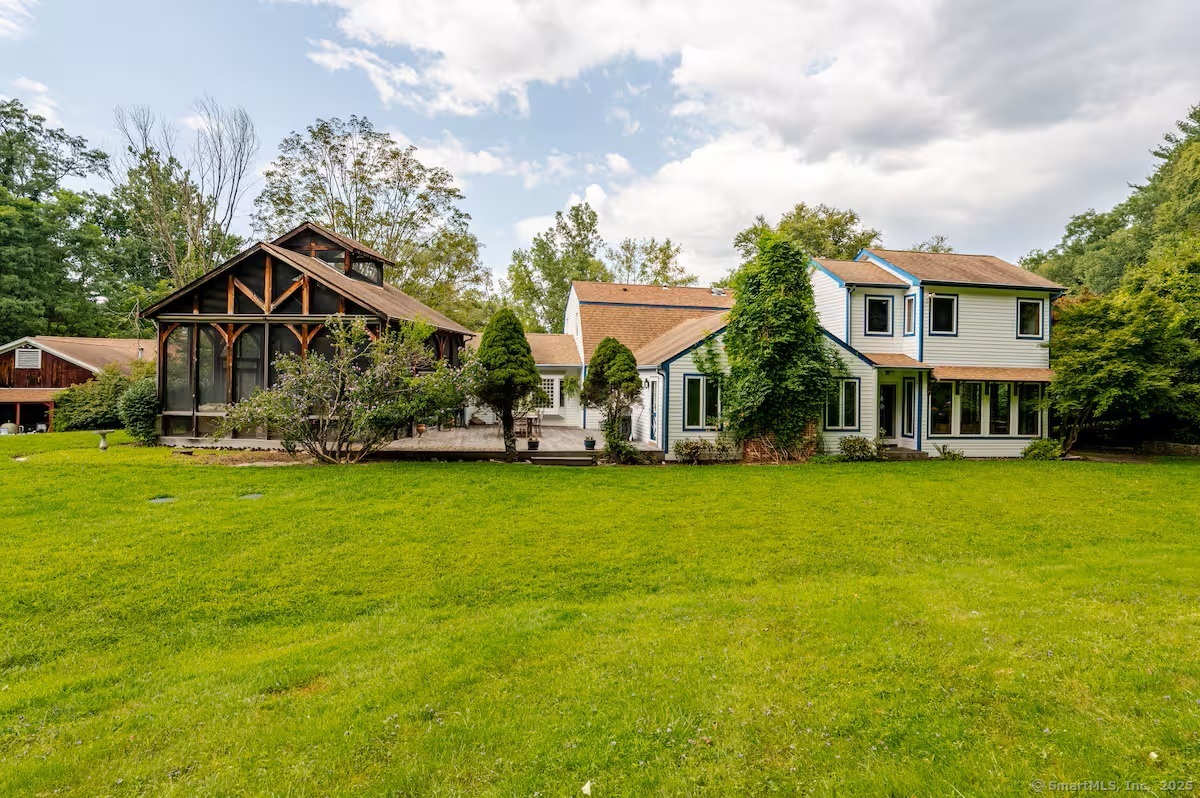 31 Cedar Hill Road New Milford, CT 06755 - Photo 36 of 40 a front view of a house with a garden