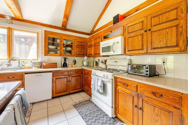 a kitchen with stainless steel appliances granite countertop a sink and cabinets