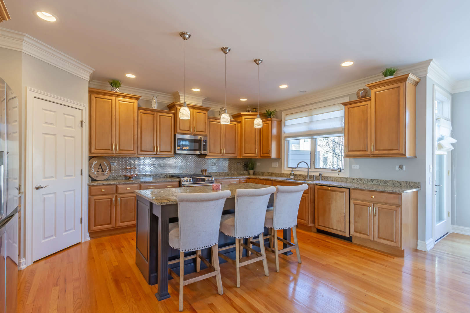32 Bluestone Drive St. Charles, IL 60174 - Photo 14 of 33 a kitchen with a sink cabinets and wooden floor