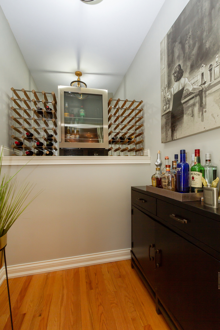 32 Bluestone Drive St. Charles, IL 60174 - Photo 16 of 33 a room with a wooden floor and cabinets