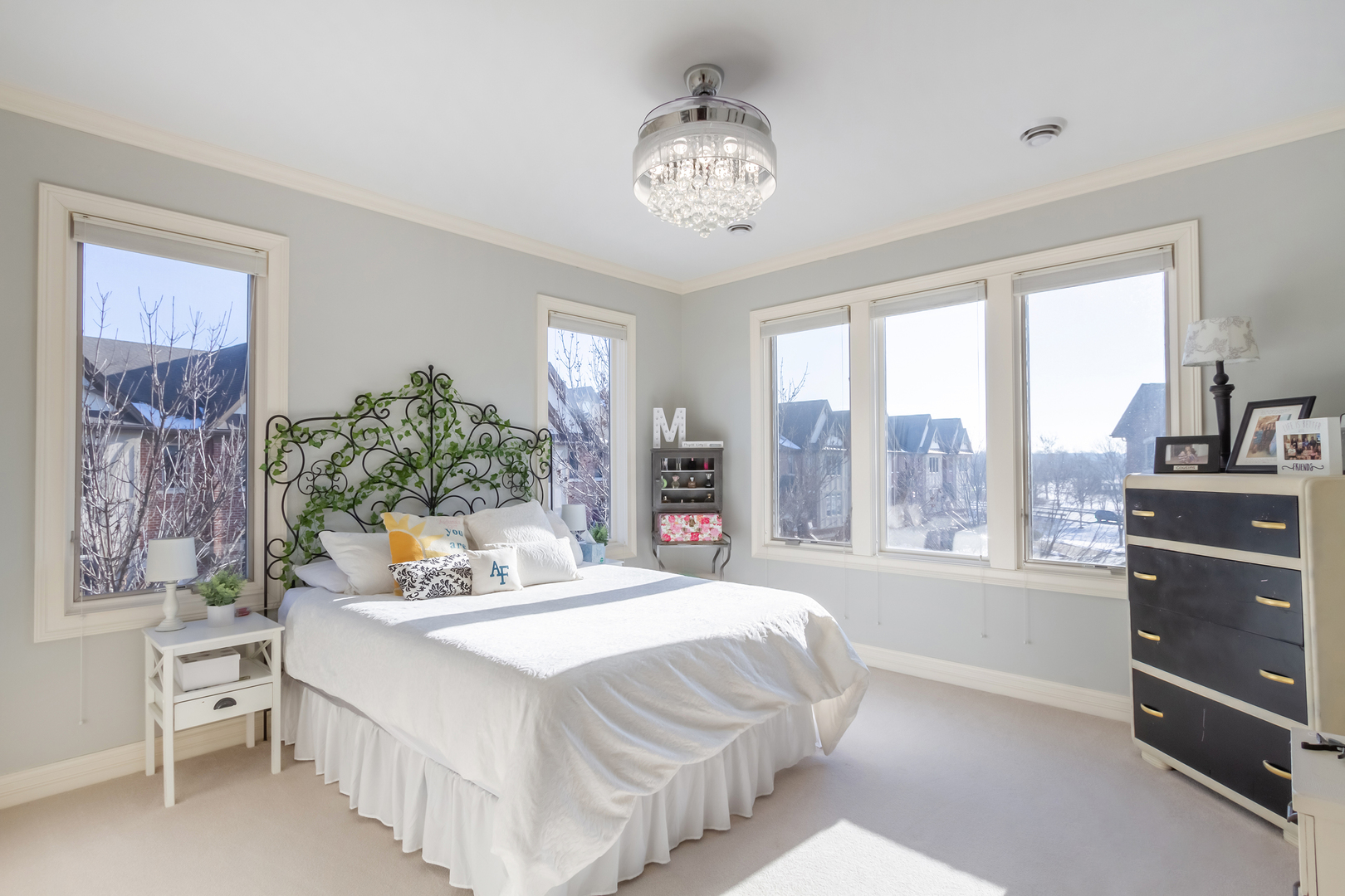 32 Bluestone Drive St. Charles, IL 60174 - Photo 24 of 33 a bedroom with a large bed and a chandelier