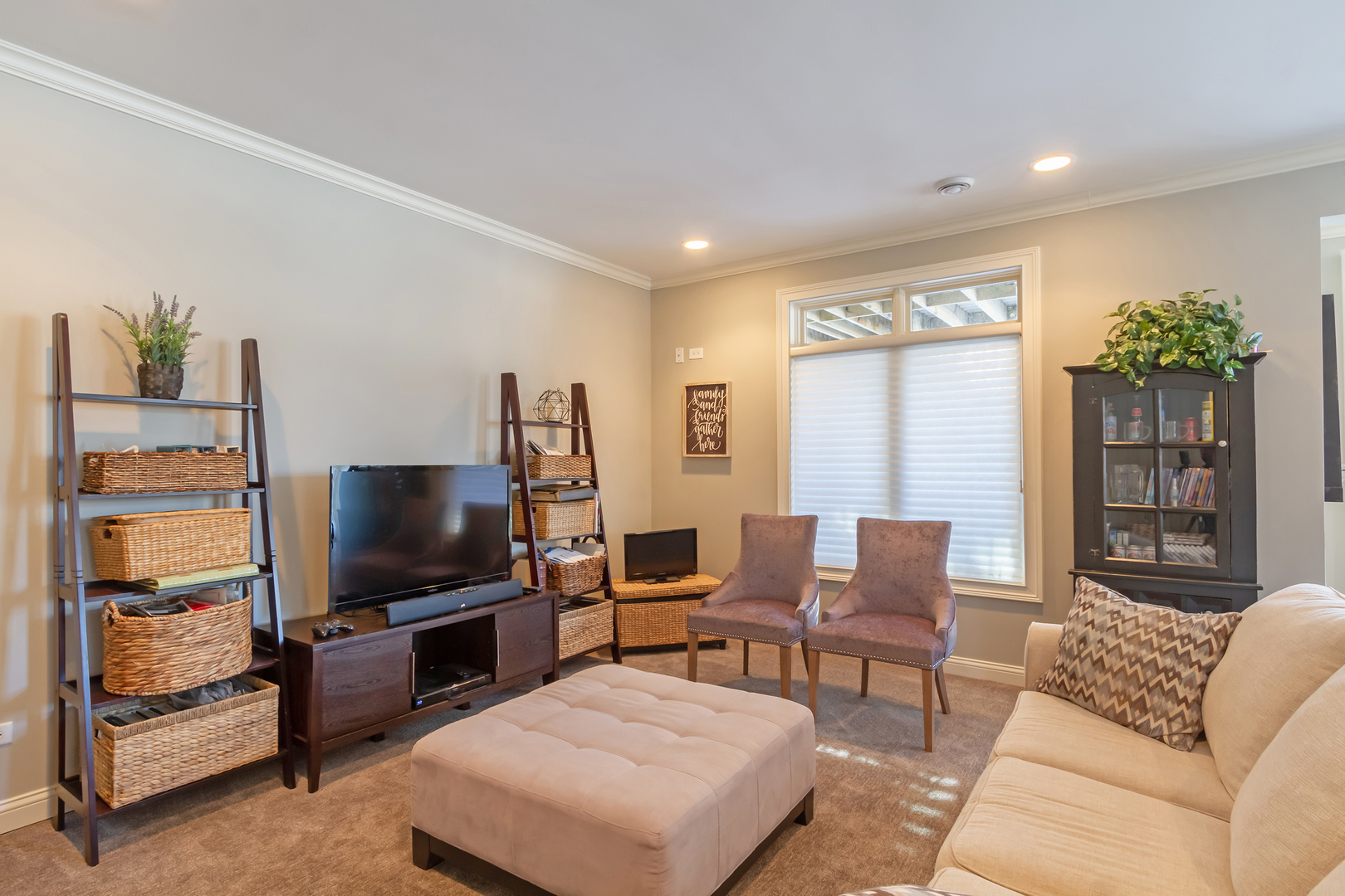 32 Bluestone Drive St. Charles, IL 60174 - Photo 28 of 33 a living room with furniture and a flat screen tv