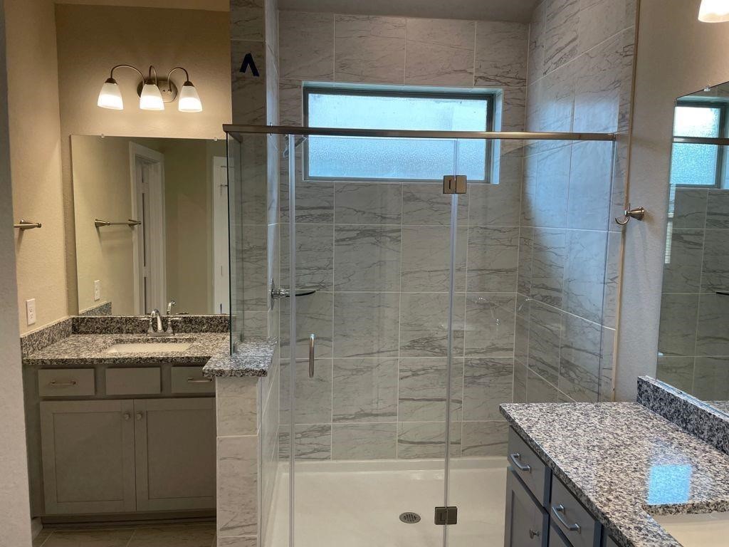 7912 Spring Run North Richland Hills, TX 76182 - Photo 2 of 21 a bathroom with a granite countertop sink and mirror