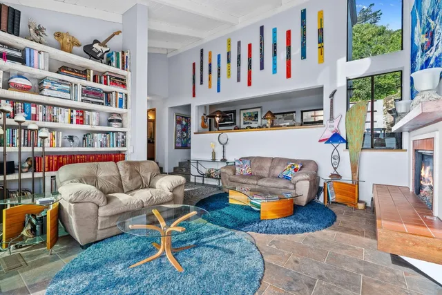 a living room with furniture cabinets and a book shelf