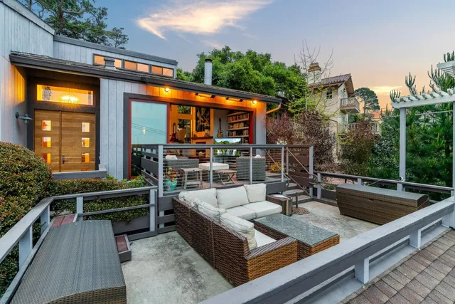 a view of a patio with swimming pool table and chairs