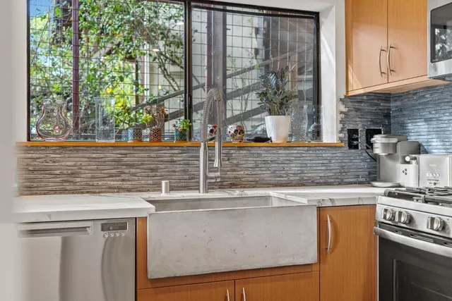 a kitchen with a stove and a white refrigerator