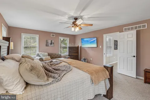 a bed room with a bed and a window