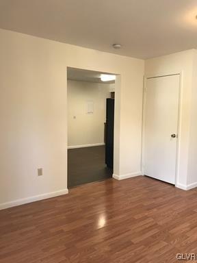1538 East 8th Street, Unit A Bethlehem, PA 18015 - Photo 12 of 31 a view of an empty room with wooden floor and closet