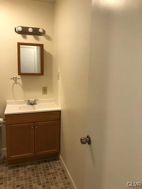 1538 East 8th Street, Unit A Bethlehem, PA 18015 - Photo 15 of 31 a bathroom with a sink and a mirror