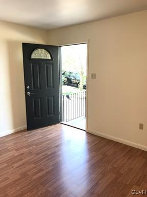 1538 East 8th Street, Unit A Bethlehem, PA 18015 - Photo 2 of 31 a view of an empty room with wooden floor and a window
