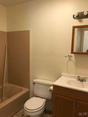 1538 East 8th Street, Unit A Bethlehem, PA 18015 - Photo 27 of 31 a bathroom with a sink a toilet and shower