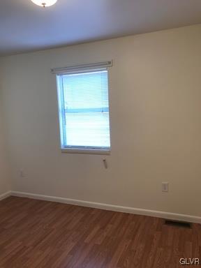 1538 East 8th Street, Unit A Bethlehem, PA 18015 - Photo 29 of 31 a view of an empty room with wooden floor and a window