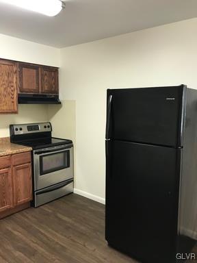 1538 East 8th Street, Unit A Bethlehem, PA 18015 - Photo 5 of 31 a kitchen with a refrigerator and a stove