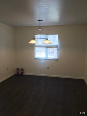 1538 East 8th Street, Unit A Bethlehem, PA 18015 - Photo 7 of 31 a view of wooden floor and a chandelier in a room
