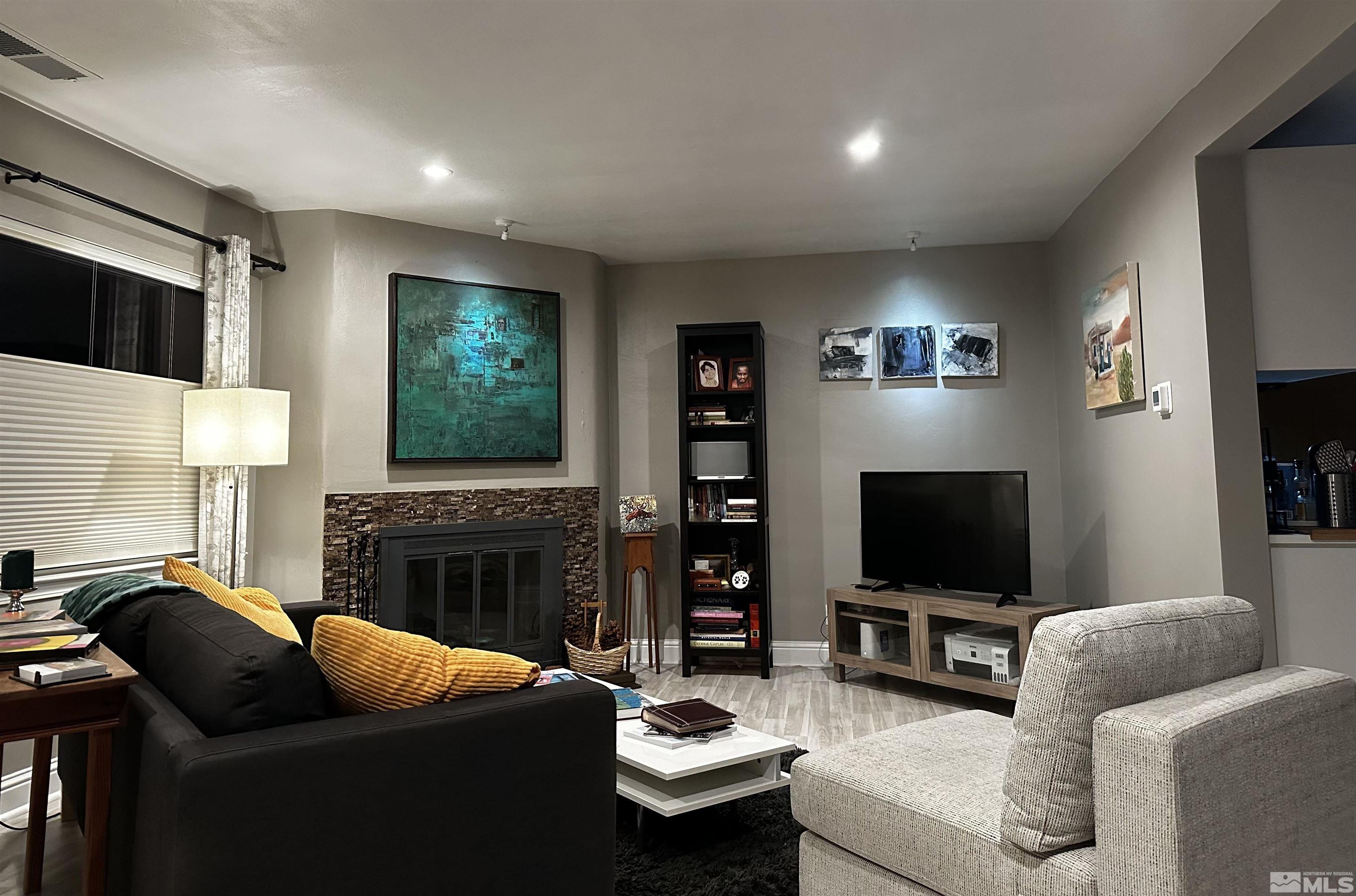 798 Broadway Boulevard Reno, NV 89502 - Photo 2 of 12 a living room with fireplace furniture and a flat screen tv