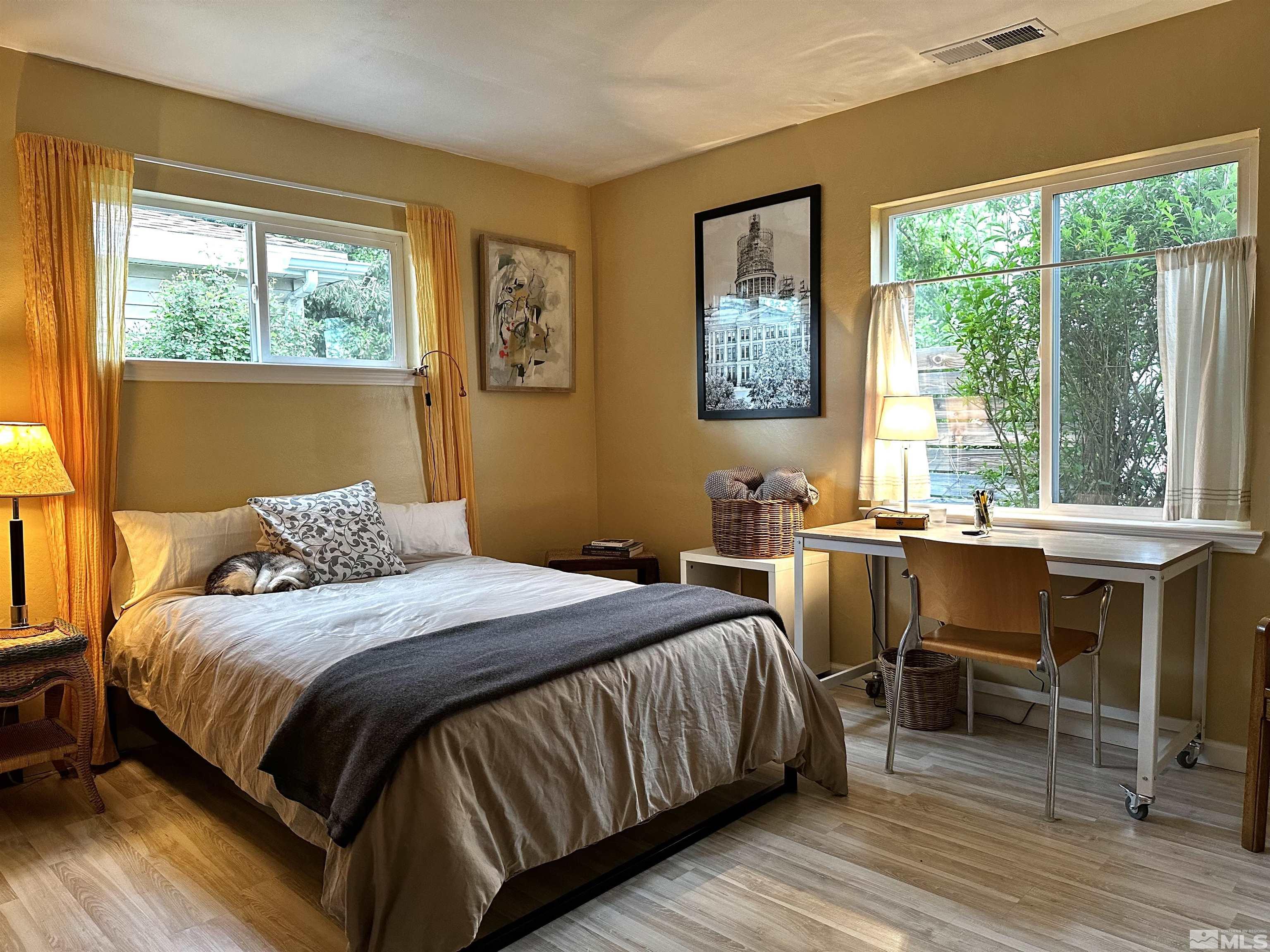 798 Broadway Boulevard Reno, NV 89502 - Photo 6 of 12 a bedroom with a bed and a large window