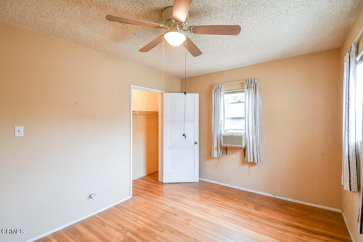 9533 Burma Road Pico Rivera, CA 90660 - Photo 13 of 17 a view of an empty room with window and a ceiling fan
