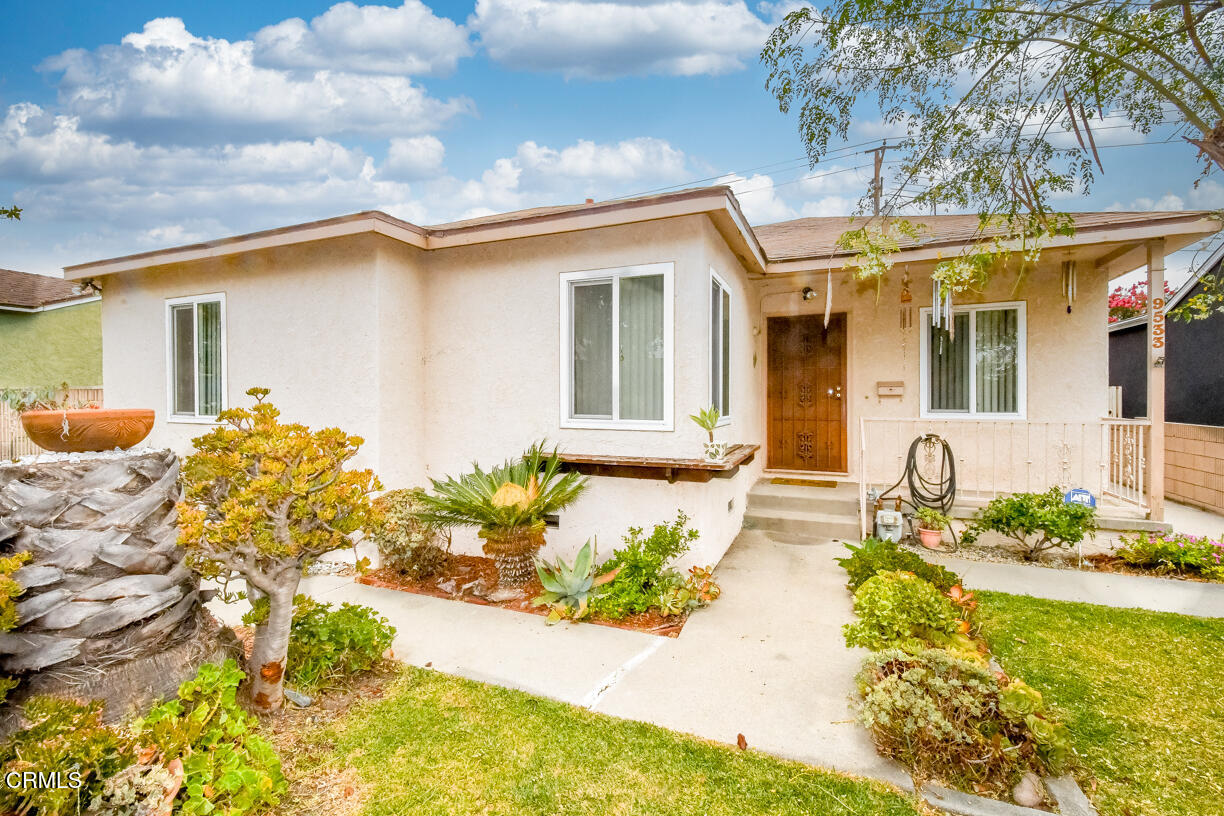 9533 Burma Road Pico Rivera, CA 90660 - Photo 3 of 17 a front view of a house with swimming pool