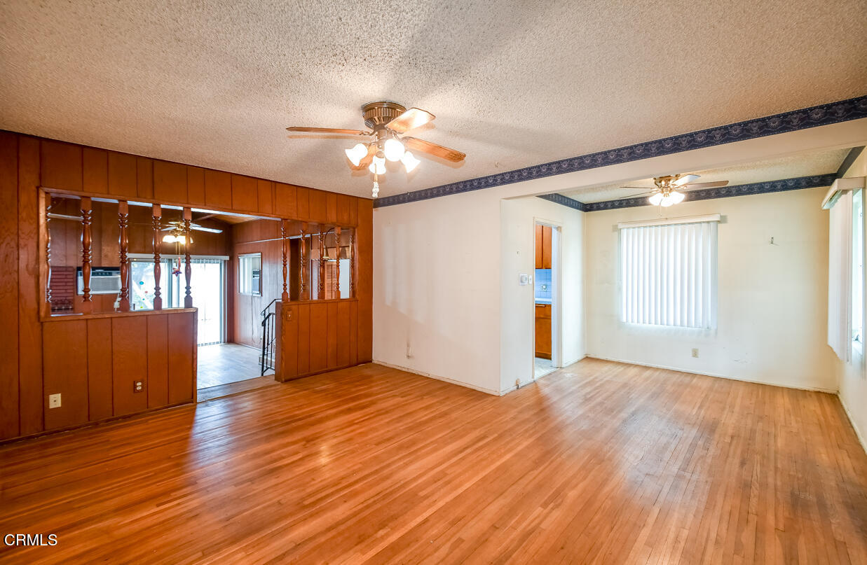 9533 Burma Road Pico Rivera, CA 90660 - Photo 6 of 17 a view of an empty room with window and wooden floor