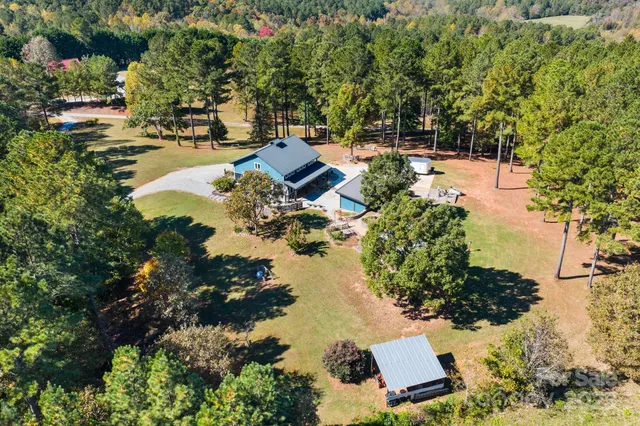 an aerial view of residential house with outdoor space