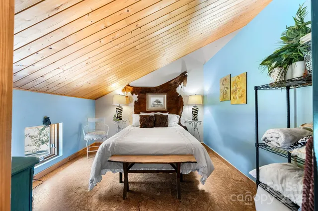 a bedroom with a bed and a walk in closet