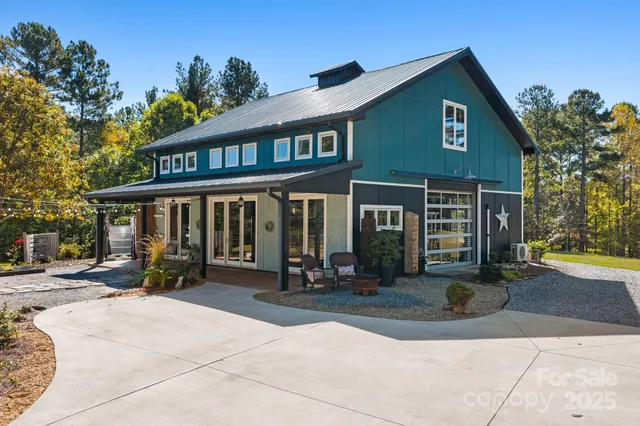 a front view of a house with sitting area