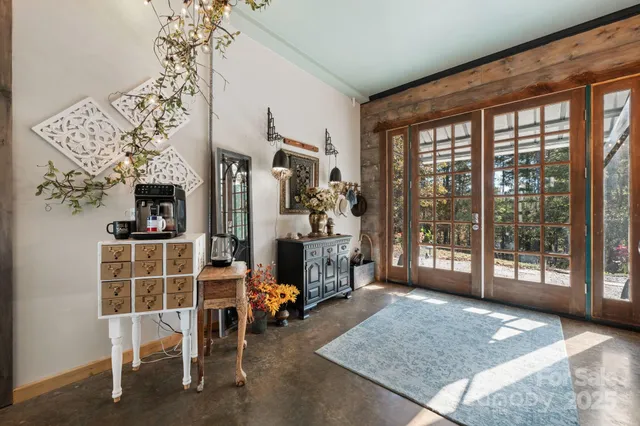 a view of a livingroom with furniture and a window