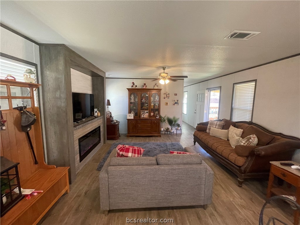 11320 Old Hearne Road Bryan, TX 77807 - Photo 10 of 26 a living room with furniture and a flat screen tv