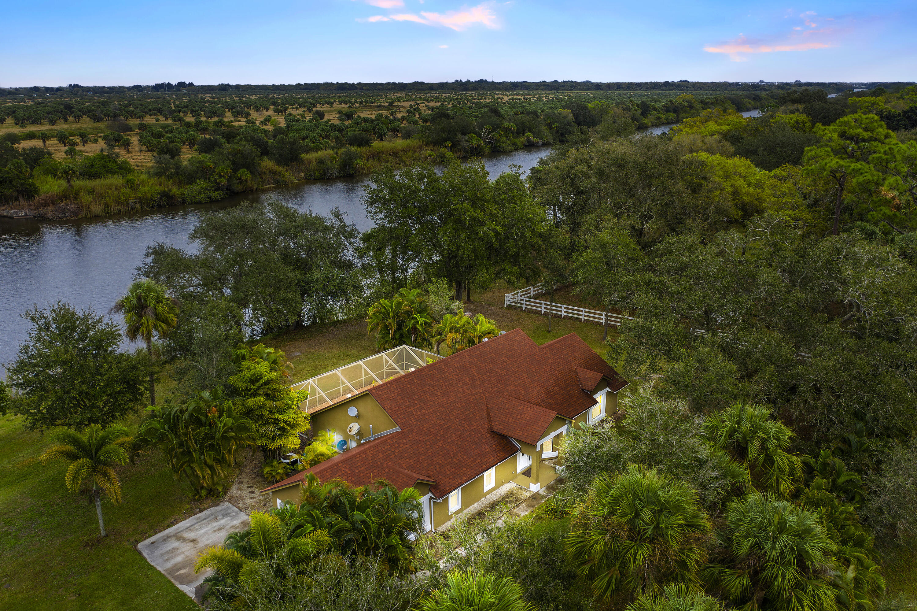 an aerial view of lake residential houses with outdoor space and trees