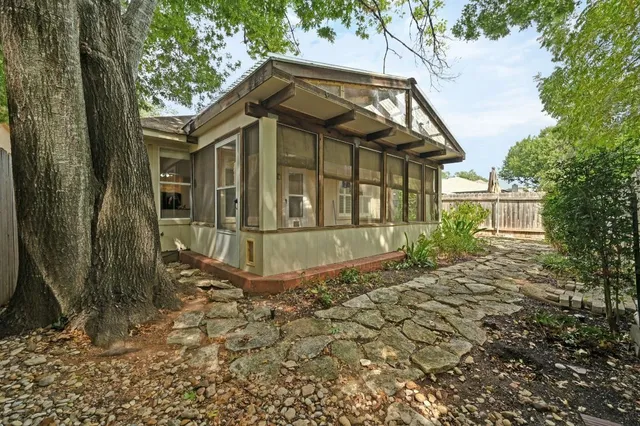a front view of a house with garden