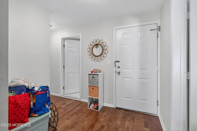 a kitchen with granite countertop appliances a sink dishwasher and cabinets