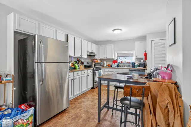 a bedroom with a bed and a desk